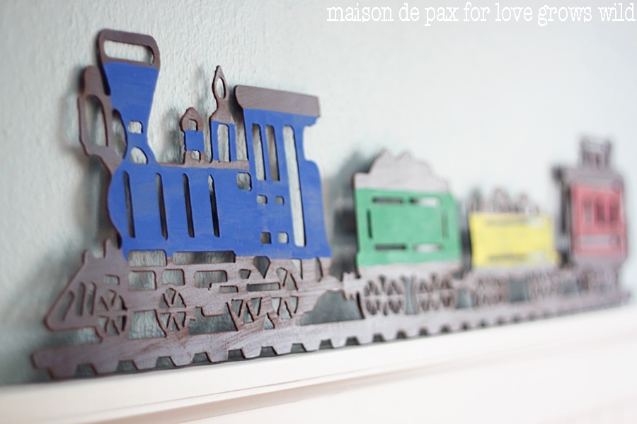 Add a little craft paint to an old metal sign and make an adorable statement piece!