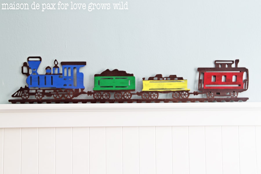 Add a little craft paint to an old metal sign and make an adorable statement piece!