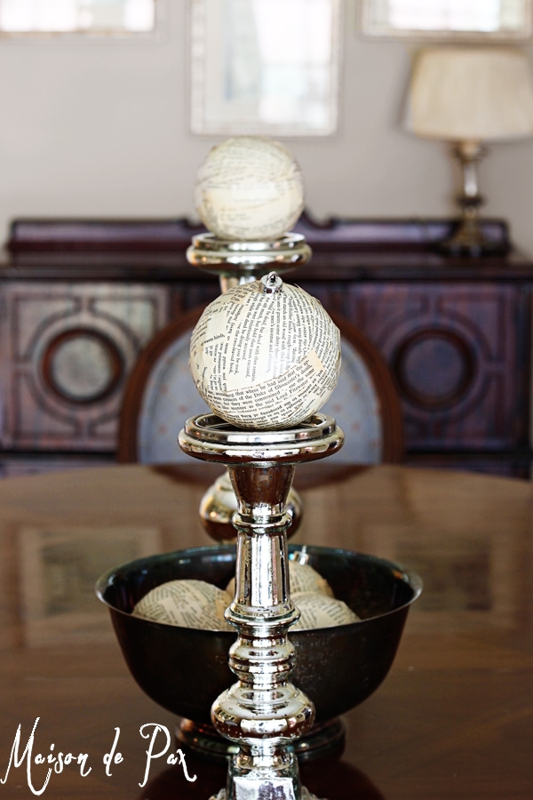 book page ornaments atop candlesticks