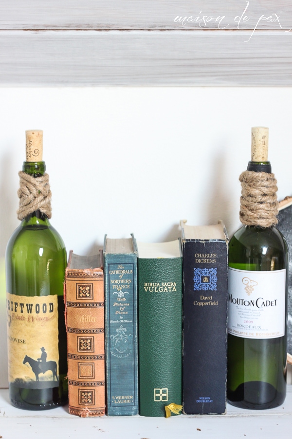 Use empty wine bottles (filled with water or sand) as bookends!  via maisondepax.com