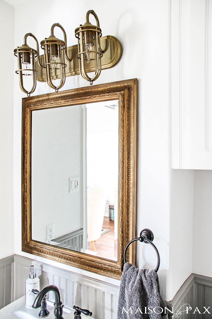 gorgeous rustic, chic bathroom: gold mirror, rustic wood towel rack... perfect balance of high and low | maisondepax.com