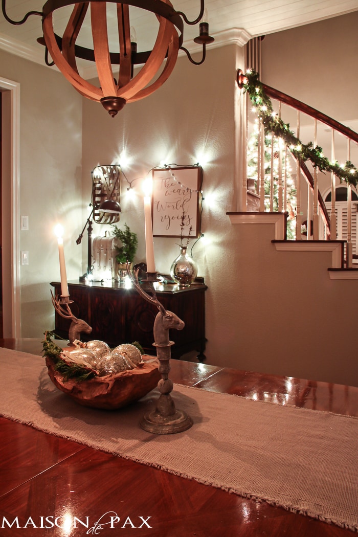 holiday decorating: globe christmas lights above buffet, lighted garland on stairs