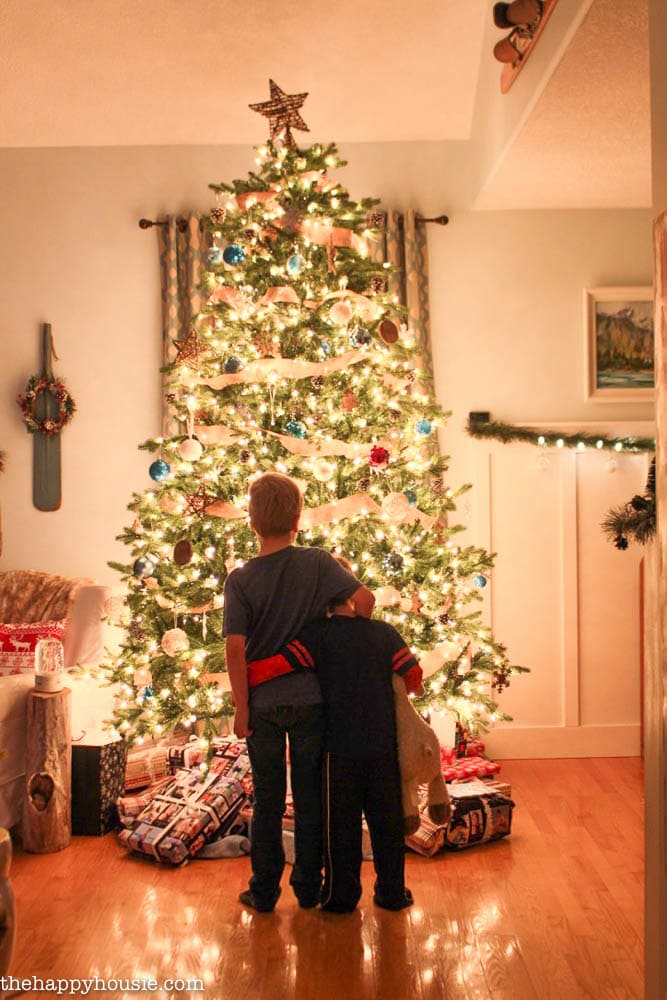 precious scene in front of the Christmas tree!