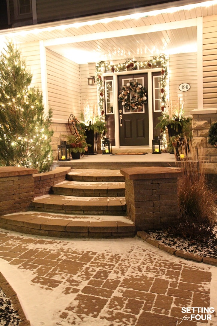 Stunning front porch decorated with Christmas lights!
