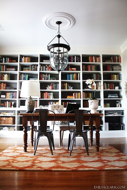 giant wall of bookcases - what a lovely office!