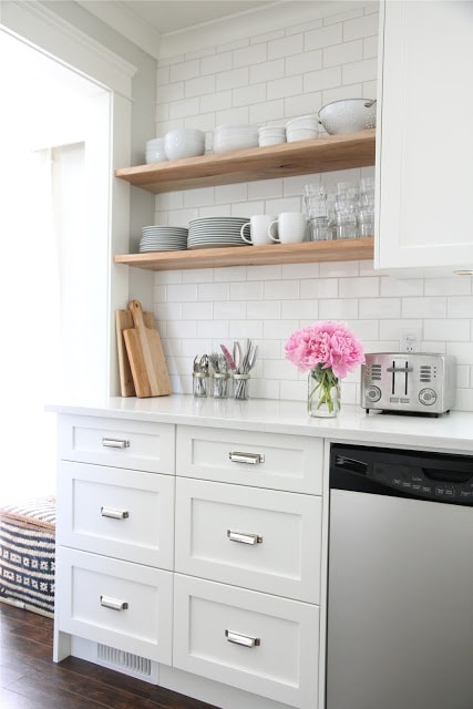 all white simple kitchen with open wood shelves