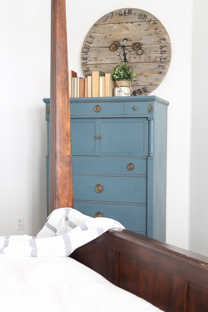 lovely soft yet deep blue antique dresser acts as an accent in this otherwise white bedroom | maisondepax.com