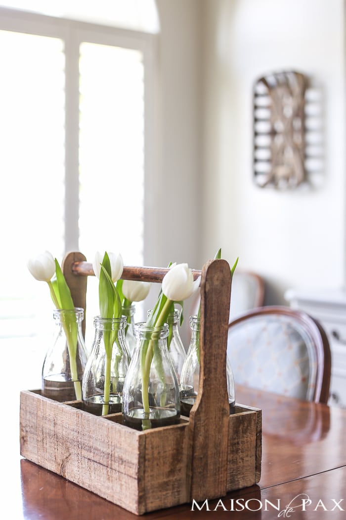 Love the rustic wood bottle caddy for holding single stem tulips! Tips for quick and easy decorating with flowers | maisondepax.com