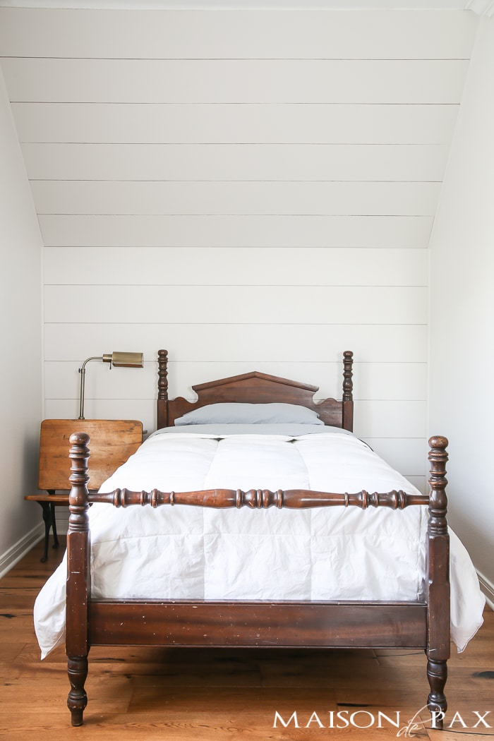 love the plank accent behind this antique bed, such a charming, farmhouse look