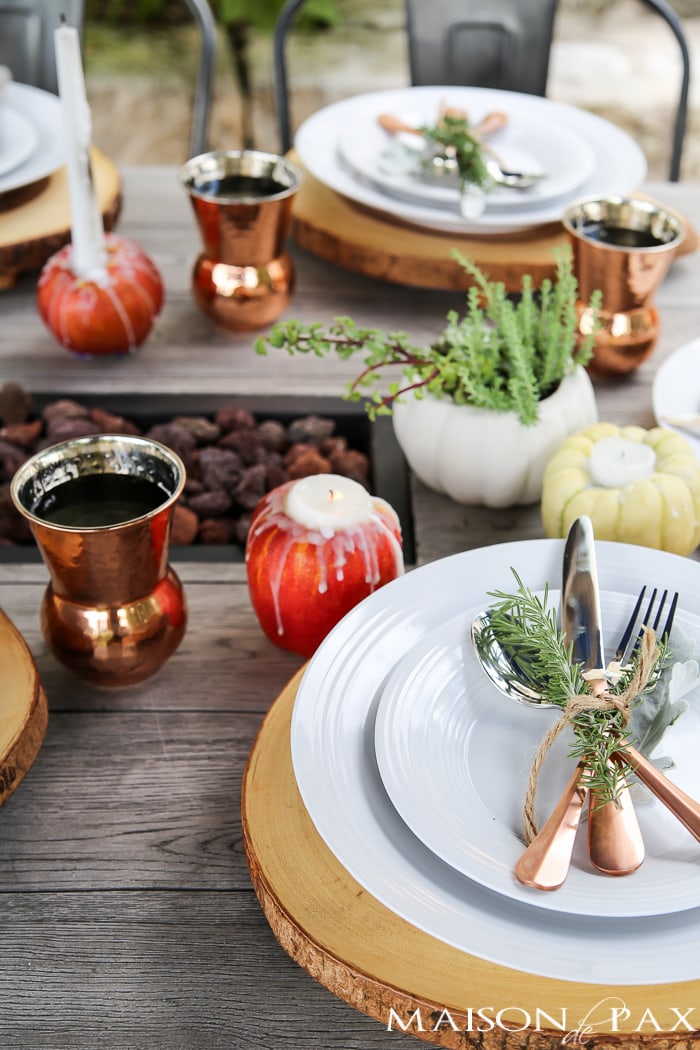 Create a rustic outdoor wedding table with candles, string lights, and greenery - Maison de Pax
