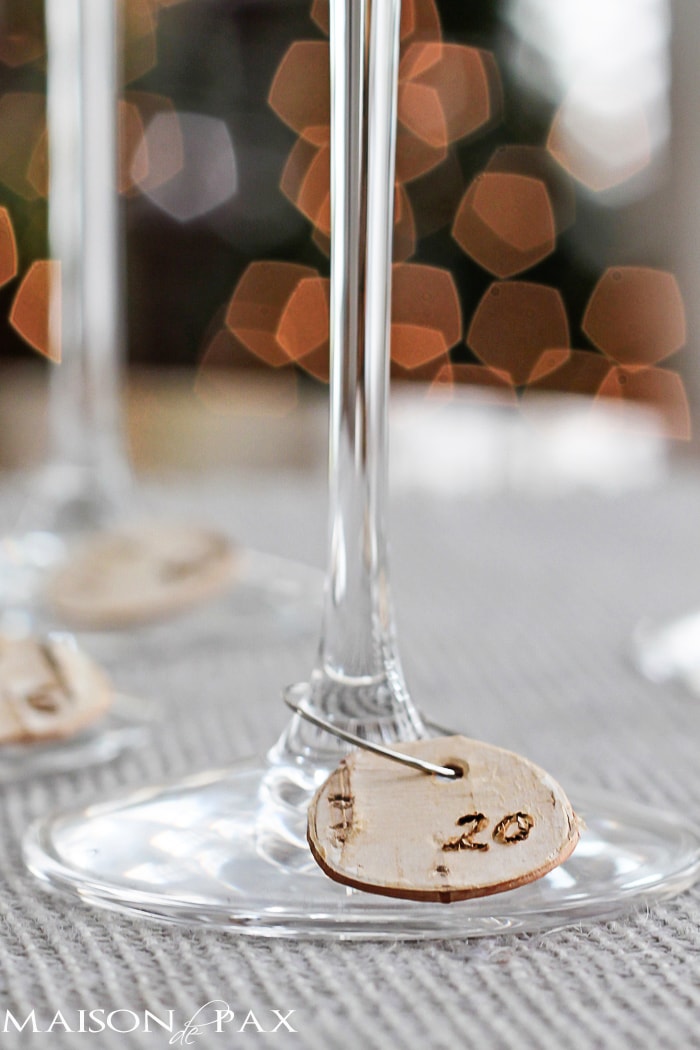 DIY Birch Bark Wine Charms: Entertaining for the holidays? These little numbered birch bark wine charms are the perfect accessory for your party so your guests can keep track of their glasses!
