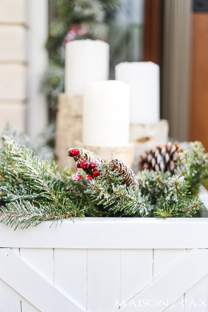 Greenery and Red Holiday Front Porch: What a beautiful, classic look! Get Christmas front porch decorating ideas here!