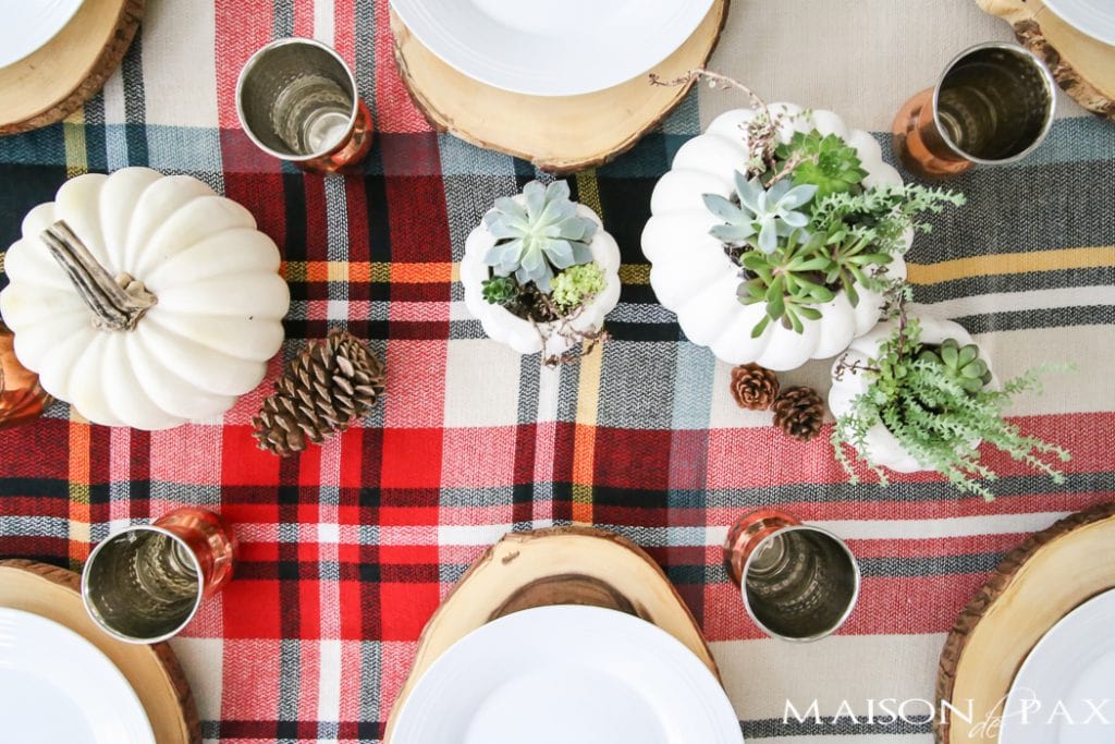 Be inspired to create a gorgeous, rustic Thanksgiving tablescape with these Thanksgiving decorating ideas! This table incorporates plaid, copper, and wood to create a beautiful yet relaxed look.