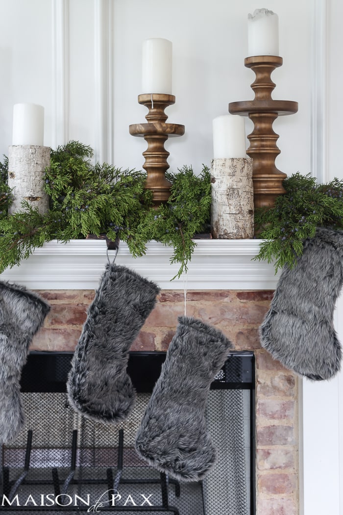 Winter Woodland Christmas Mantel: Looking for mantel decorating ideas? Some fresh cut cedar, candlesticks, and a faux deer mount creates the perfect holiday decor.