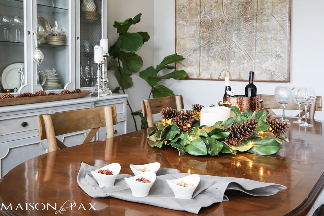 simple greenery and mercury glass makes this French farmhouse style dining room all set for Christmas!