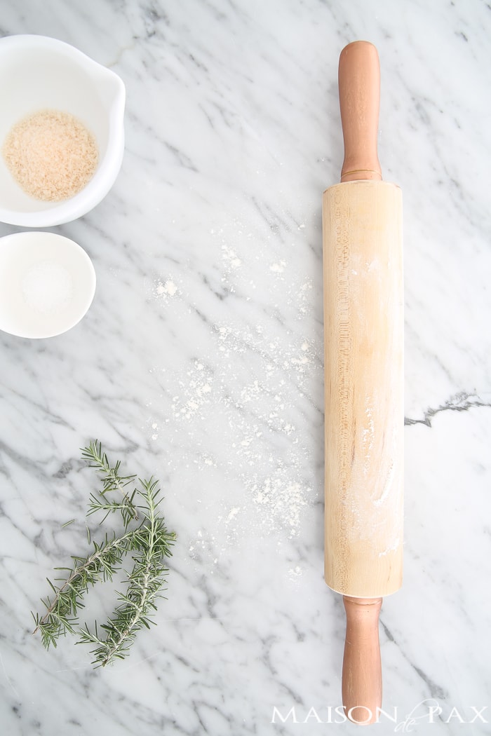 Wooden rolling pin on marble countertop- Maison de Pax