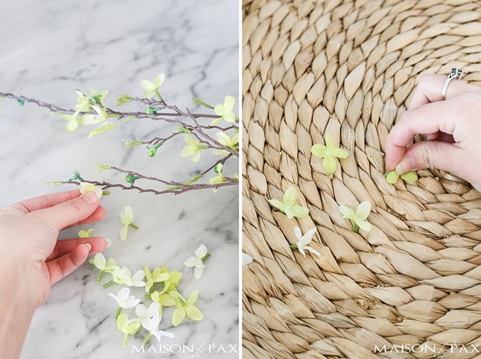 Looking for an easy spring decor idea? In about five minutes, you can turn a simple basket and inexpensive faux flowers into gorgeous spring wall art!