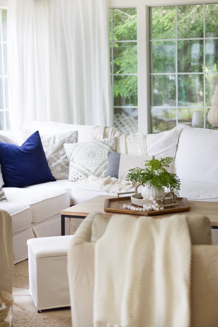 White living room with modern home textures, throws and rugs- Maison de Pax