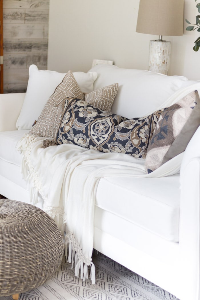 White couch with patterned throw pillows- Maison de Pax