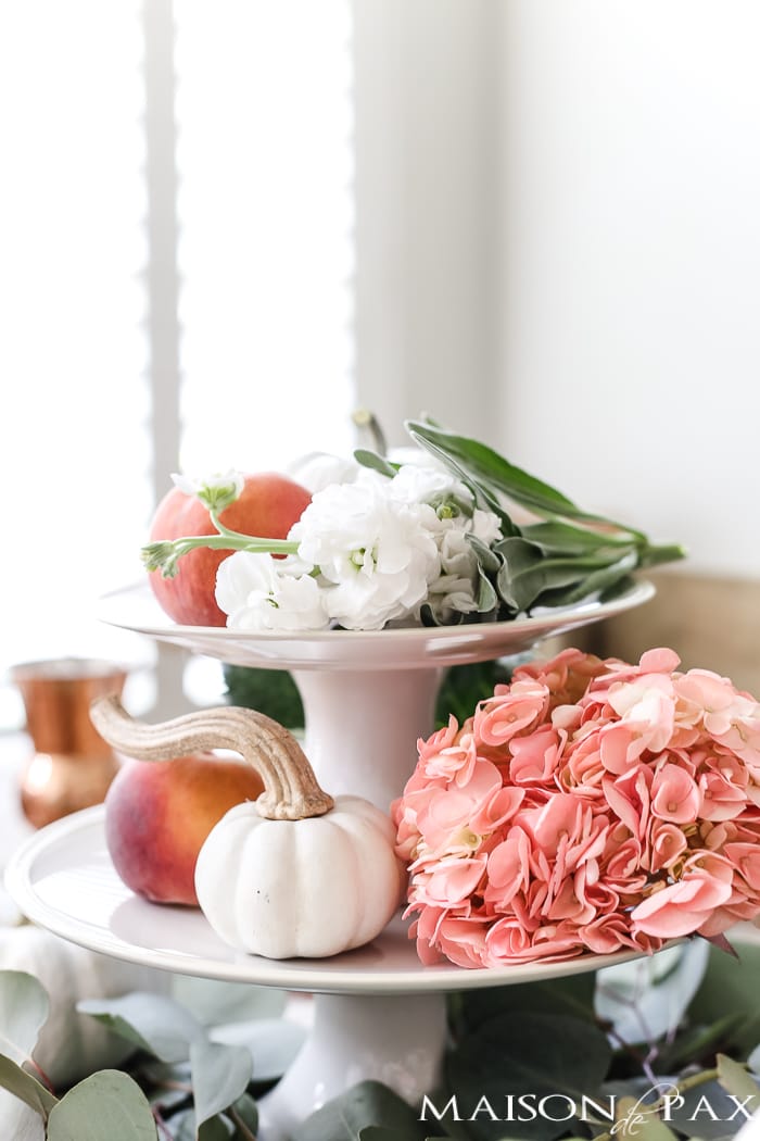 fall centerpiece: tiered cake stand with pumpkins and peaches- Maison de Pax