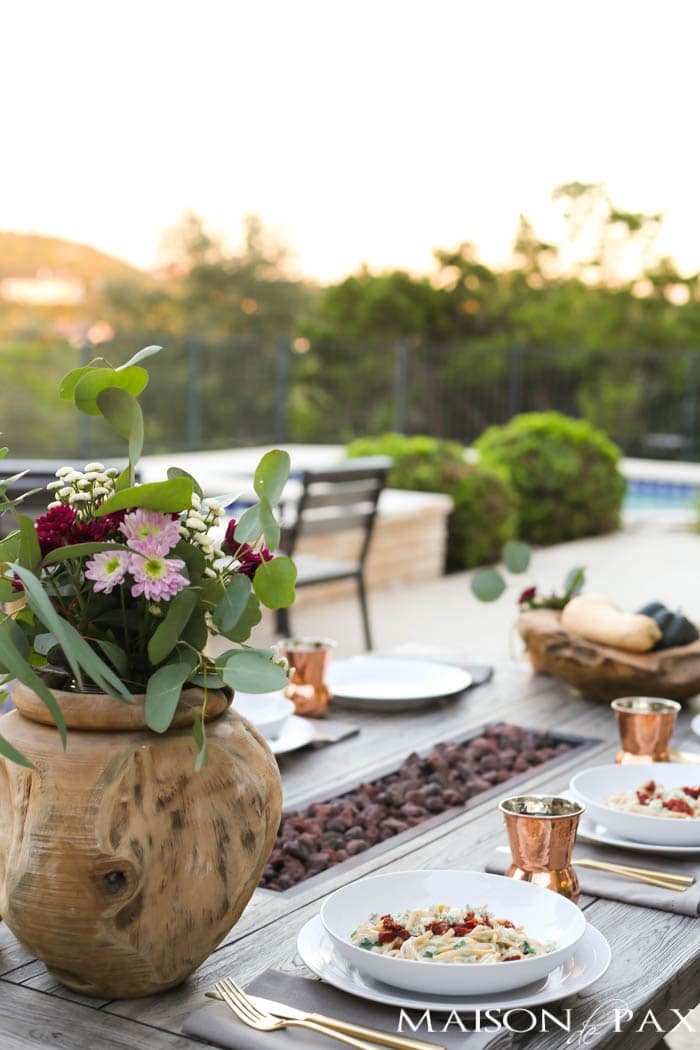 sunset outdoor poolside dining