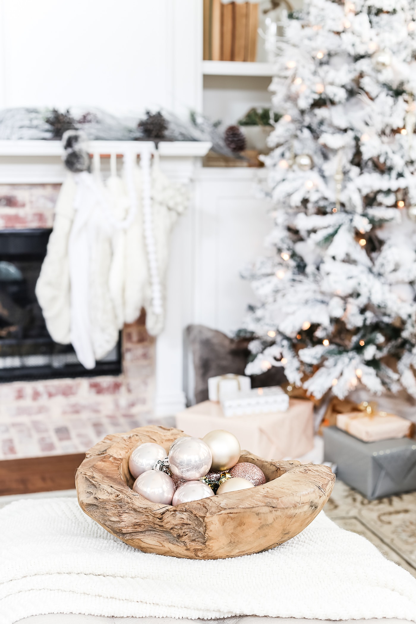 blush ornaments in a raw wood bowl make gorgeous neutral holiday decor #holidaydecorating