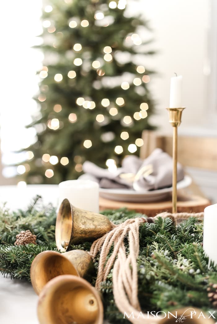 green and gold Christmas tablescape with natural centerpiece of green garland - Maison de Pax
