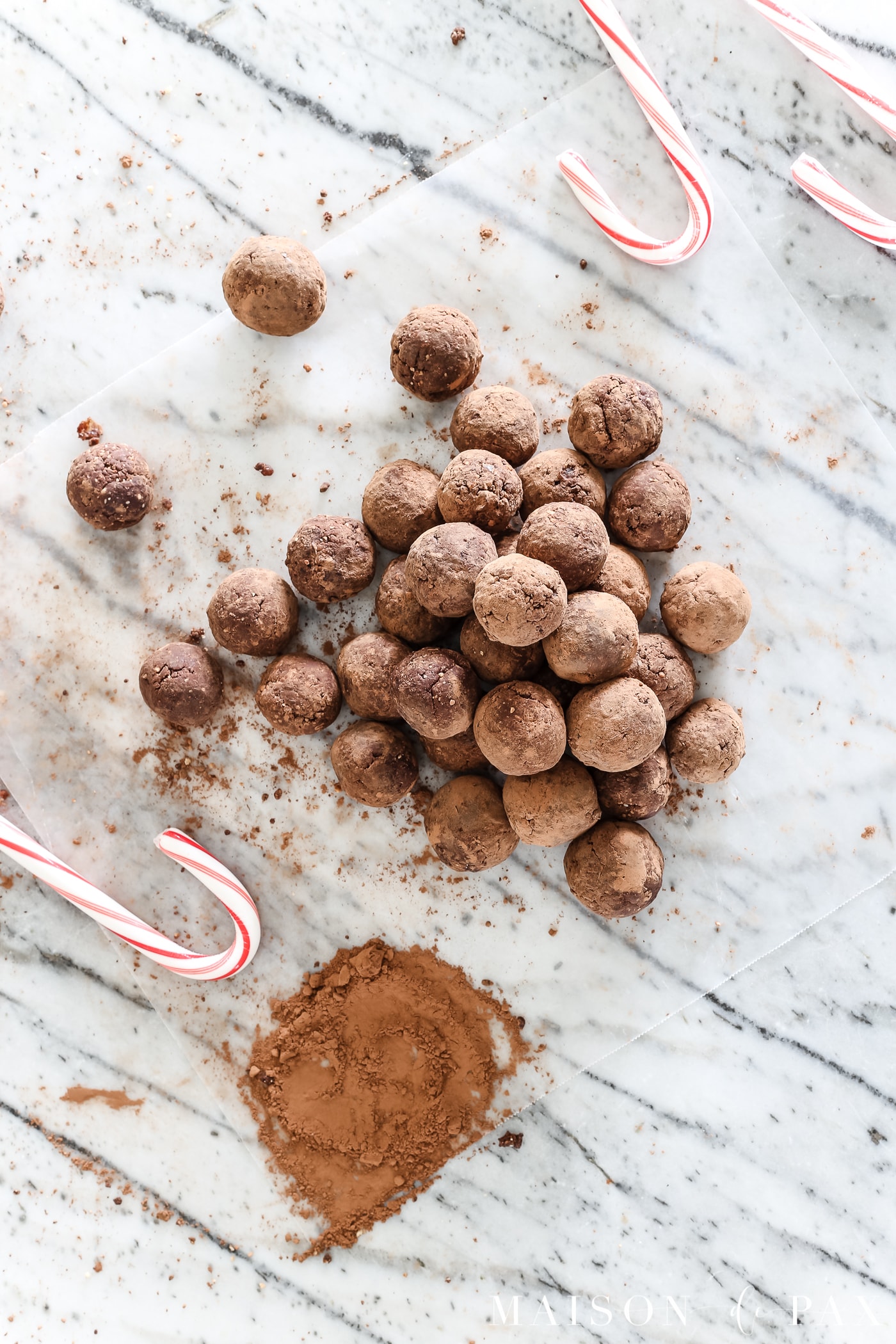 These peppermint truffles are not only delicious and decadent, they could almost be called healthy.  Packed with energy and made from dates and other natural ingredients (like a homemade Larabar), these mint chocolate bites will leave you guilt free this holiday season! #healthytreat
