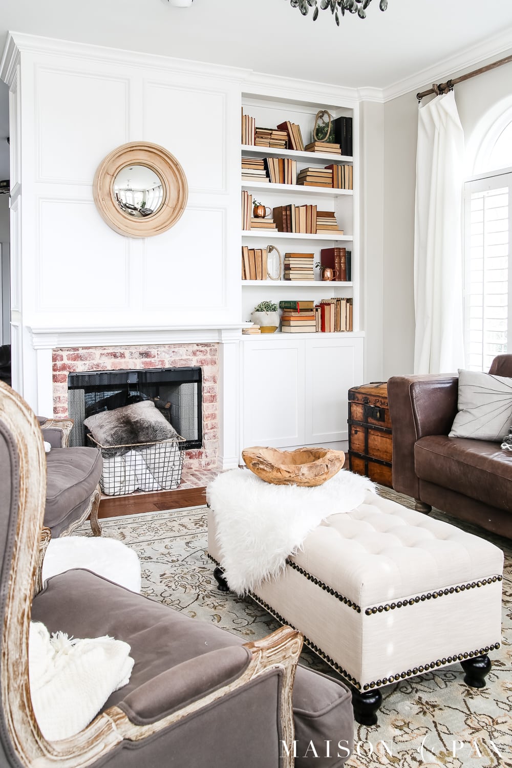 White painted fireplace with built-in with neutral books in a modern farmhouse living room- Maison de Pax