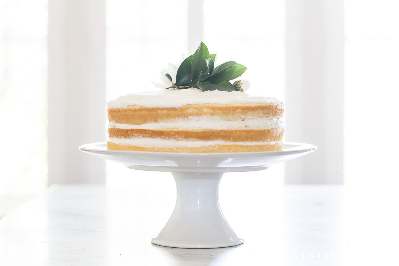 naked vanilla cake with three layers