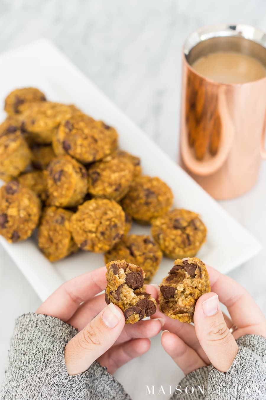 Gluten free pumpkin muffins with 70% cacao chocolate chips: Made with applesauce and a touch of maple syrup for sweetening, oat flour, and pumpkin, these are packed with delicious flavor and nutritious ingredients #gf #glutenfree #pumpkinspice #fallrecipe #pumpkinrecipe #pumpkinmuffins #breakfast #gfbreakfast 