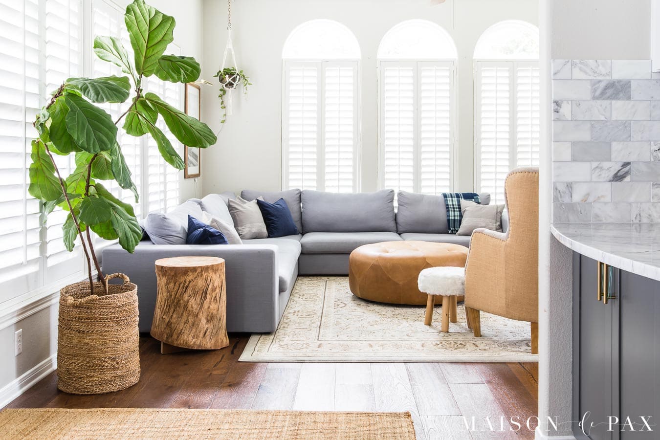 Gray, white, and navy living room with warm netural textures