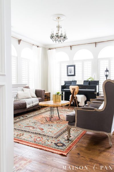 living room with colorful rug and neutral furniture | Maison de Pax