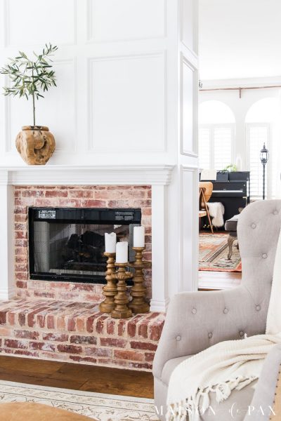 brick fireplace with white wood molding | Maison de Pax