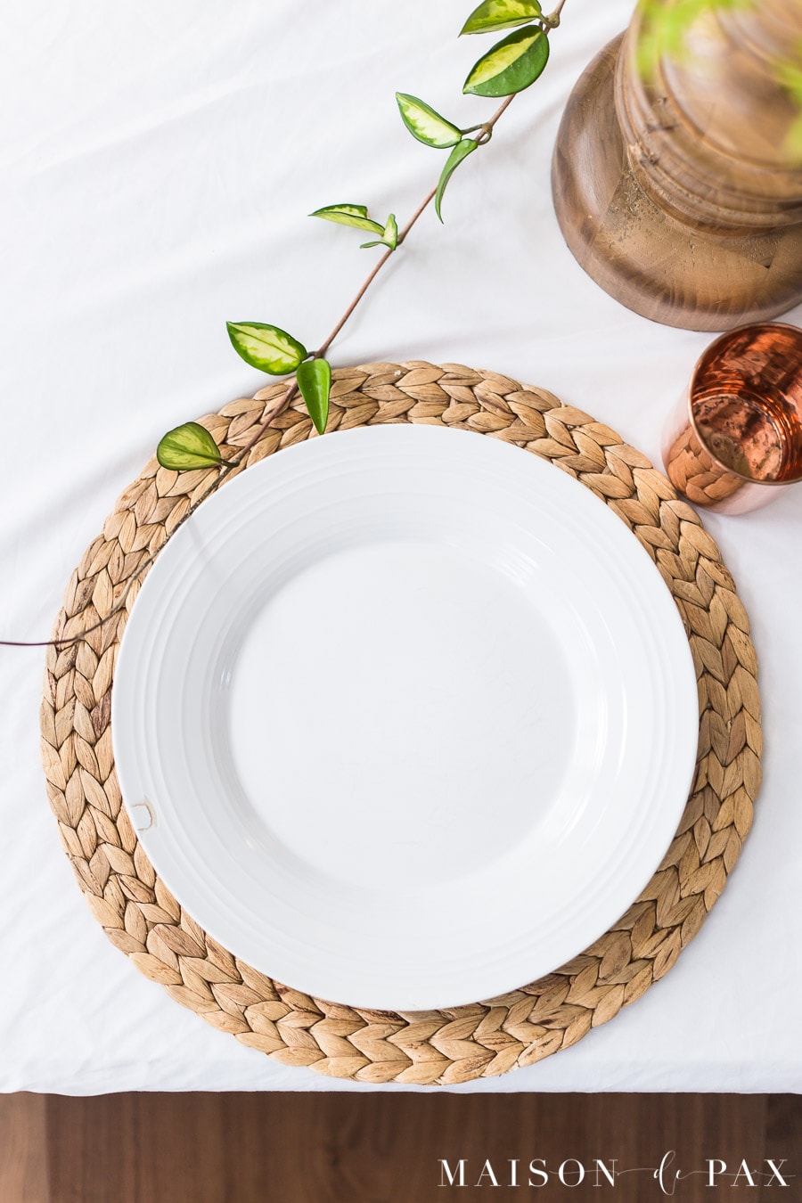 simple white dishes and woven placemat | Maison de Pax