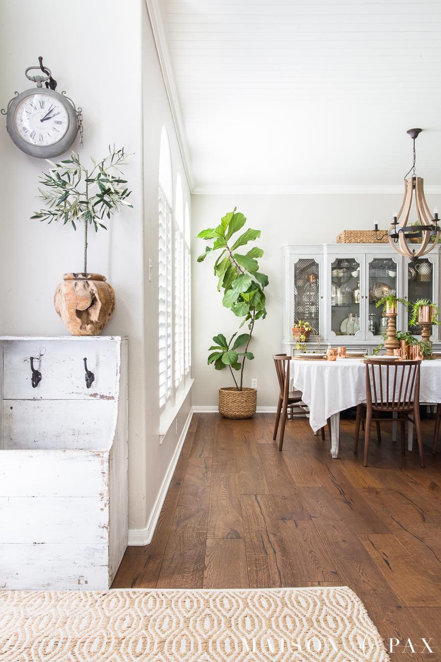 olive tree in wooden vase and elegant dining room | Maison de Pax