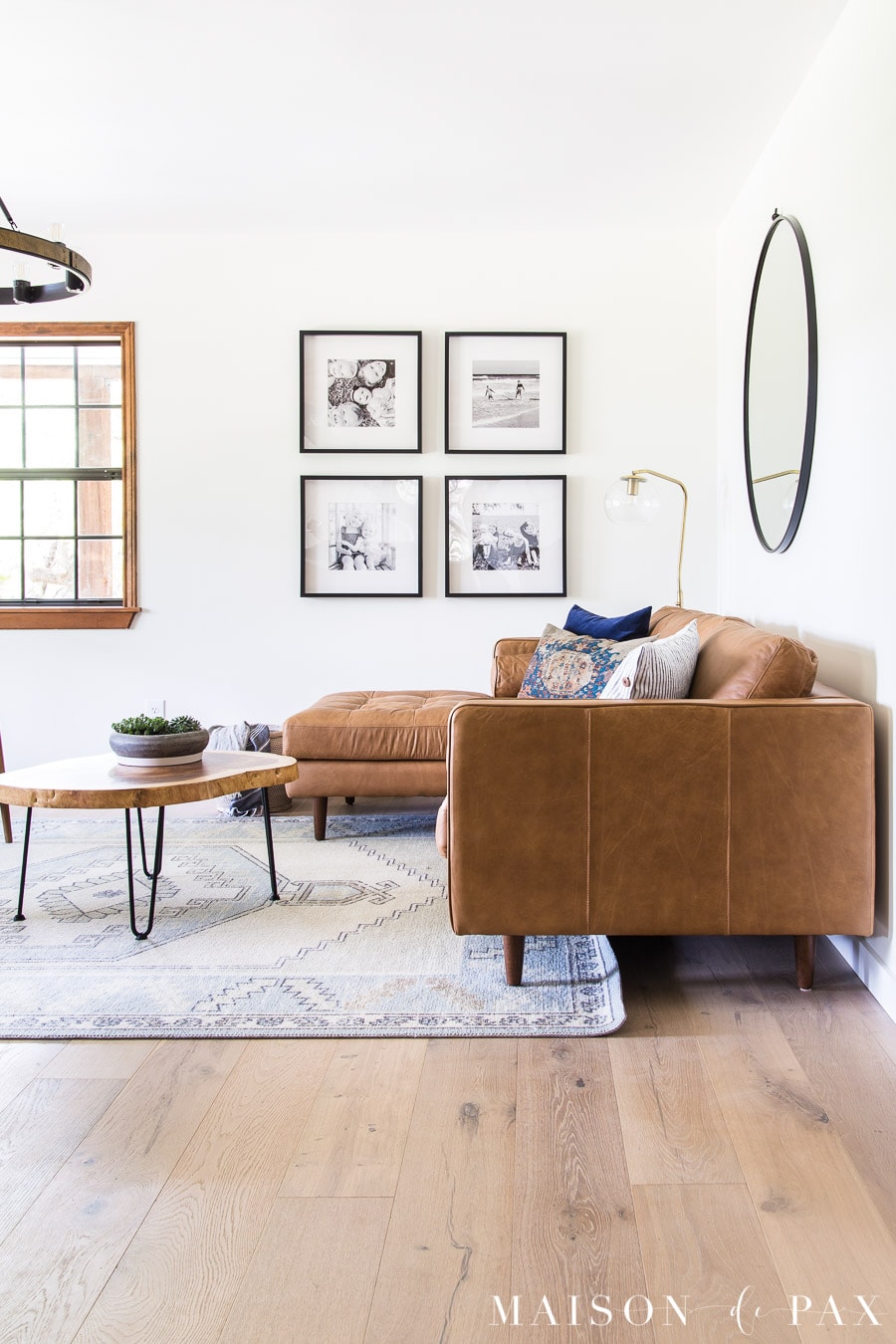 light blue rug with tan leather sectional sofa | Maison de Pax