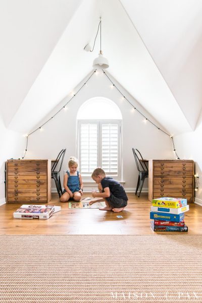 boy and girl playing board game on floor of playroom | maisondepax.com
