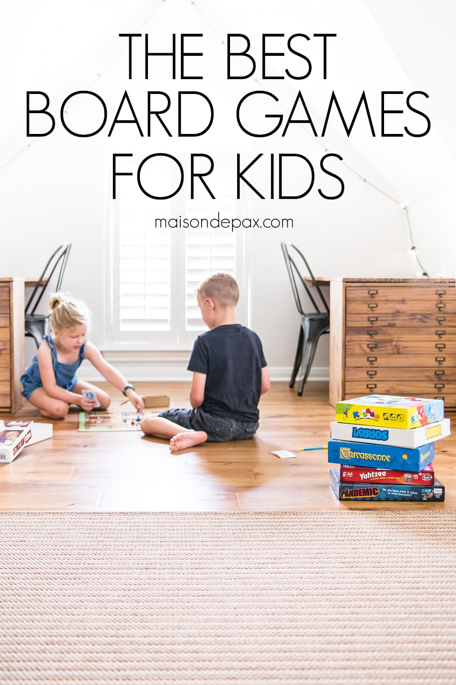 boy and girl playing board games on floor with overlay: the best board games for kids | maisondepax.com