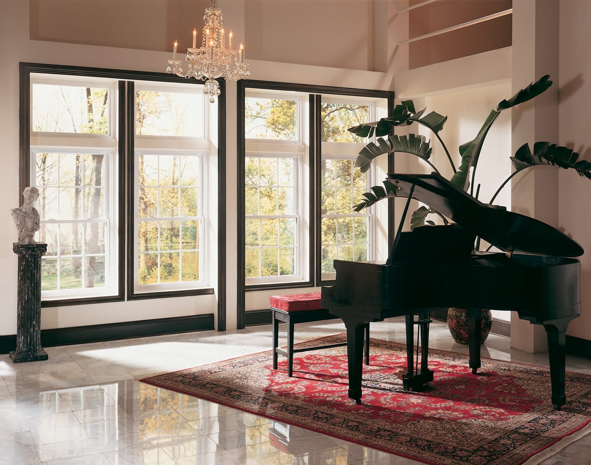 white traditional windows with black trim painted around | Maison de Pax