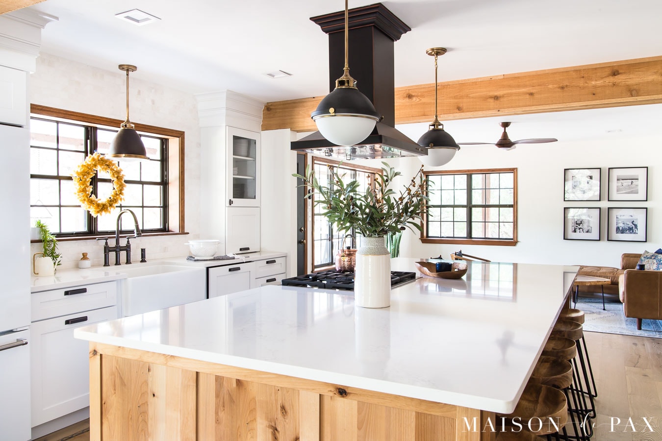 large kitchen island with quartz countertops and rustic wood | Maison de Pax