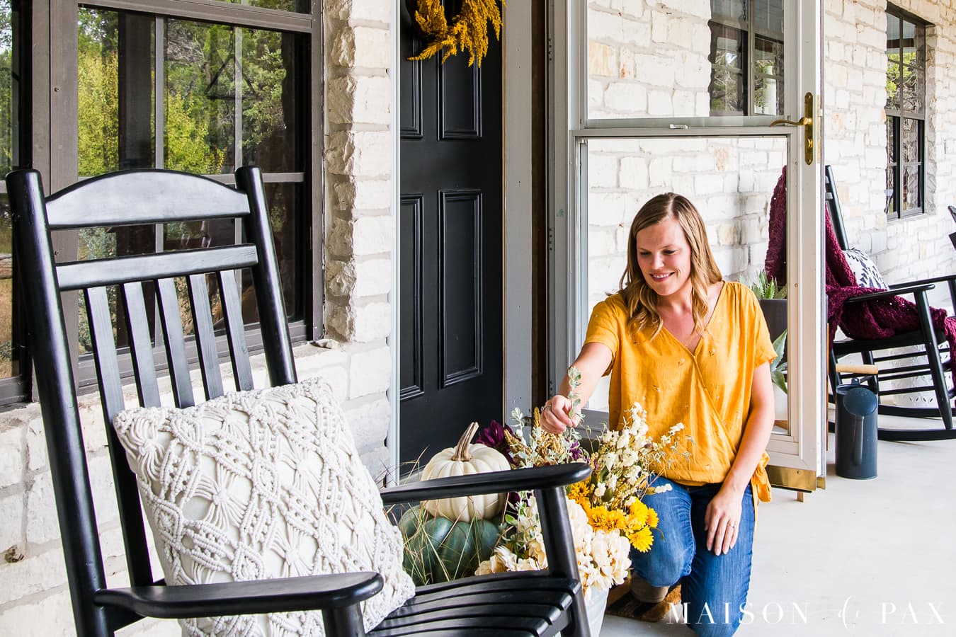 woman filling galvanized tub with fall florals for front porch | Maison de Pax