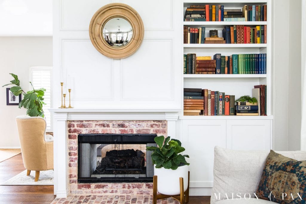 brick fireplace with white molding and built in bookcase | Maison de Pax