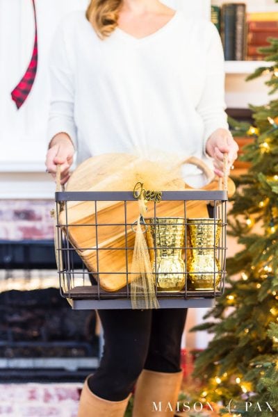 woman holding gift basket with entertaining gifts | Maison de Pax