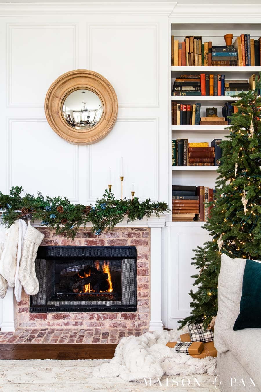 naked tree and simple garland with brick fireplace | Maison de Pax