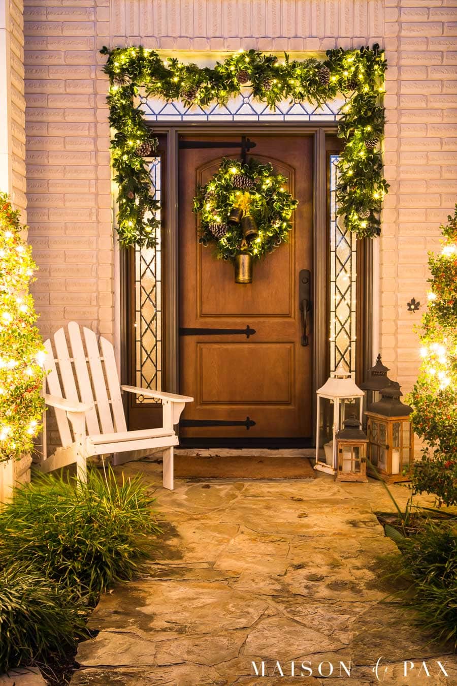 front porch with lighted garland and wreath for Christmas | maison de pax