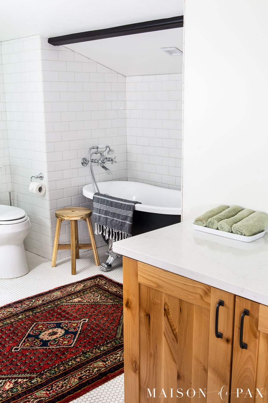 black and white tile bathroom with wood bathroom vanity | Maison de Pax