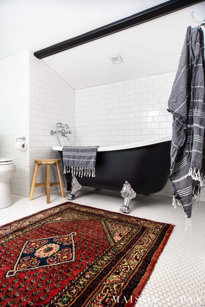 white bathroom with subway tile and black clawfoot tub | Maison de Pax