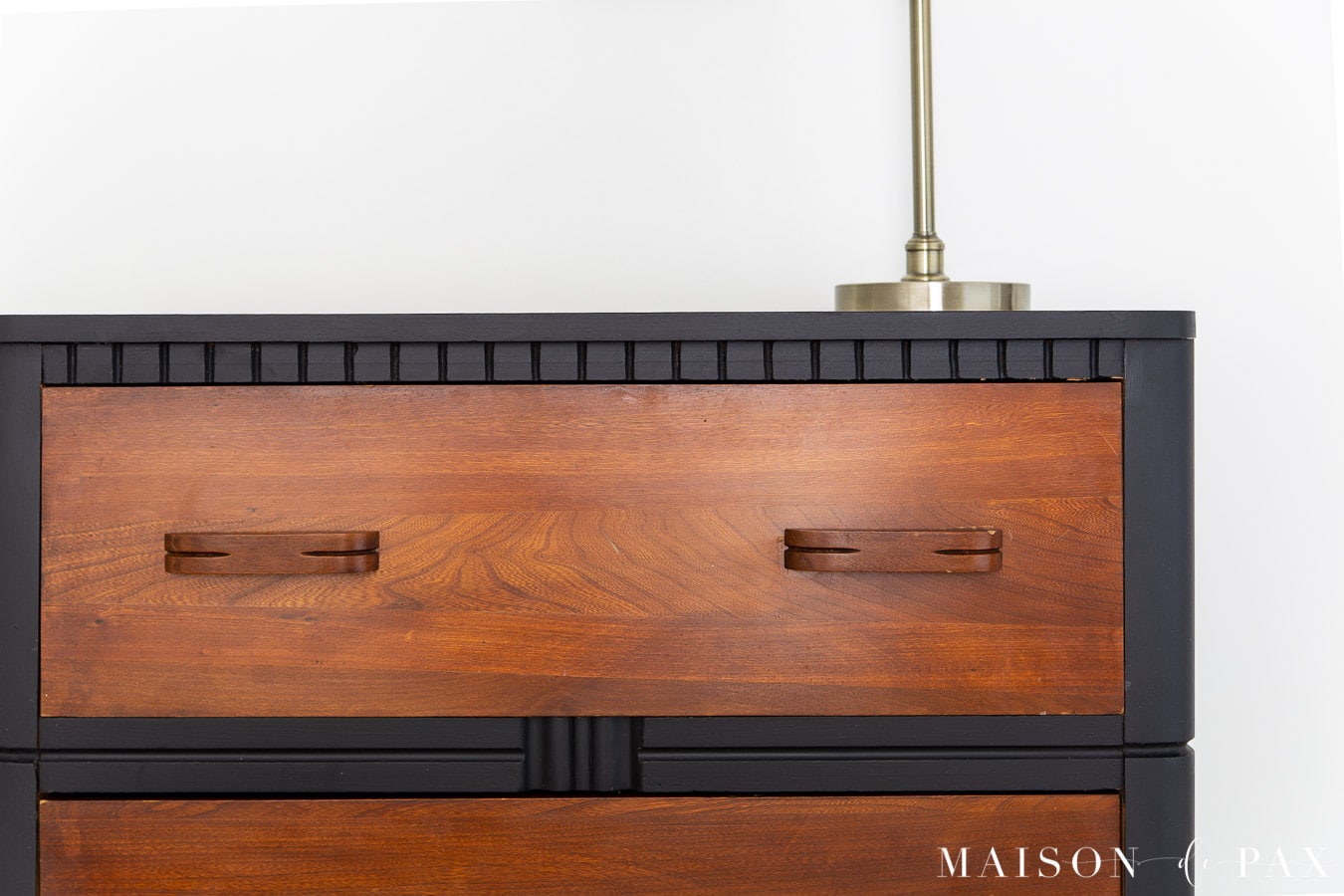 black painted dresser with stained wood drawer fronts