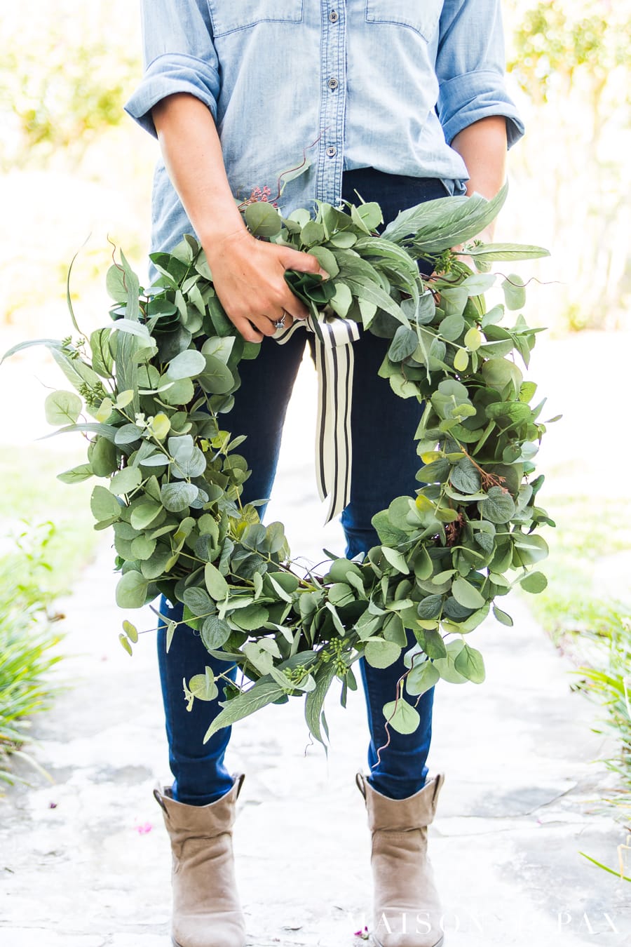 woman holding large eucalyptus wreath | Maison de Pax